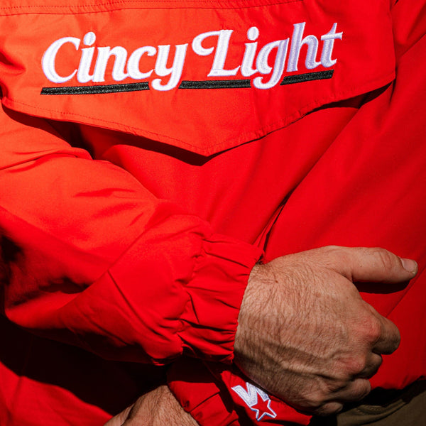Red jacket with 'Cincy Light' text on a dark background